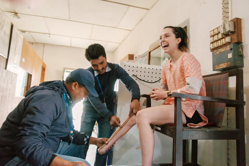 Stef Reid is fitted for her prosthetic at the workshop at Anandaban Hospital