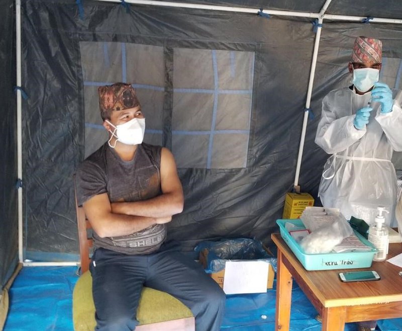 Dr Pradip Sapkota, Medical Superintendent at Anandaban Hospital in Nepal, is given the first dose of the Oxford Covid-19 vaccine