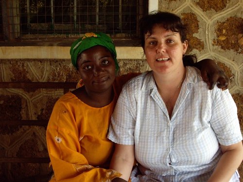 Jannine Ebenso, who supports leprosy research as part of her Senior Leadership role at The Leprosy Mission’s International office, with a leprosy patient in Nigeria in the late 1990s