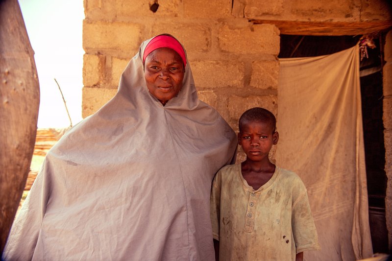 Nasiru is pictured with his mother Ramatu who is disabled by leprosy.JPG