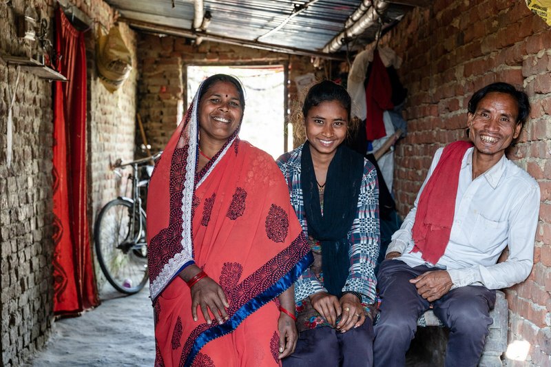 Raj Kumar, a man affected by leprosy, with his family at their home in Nepal