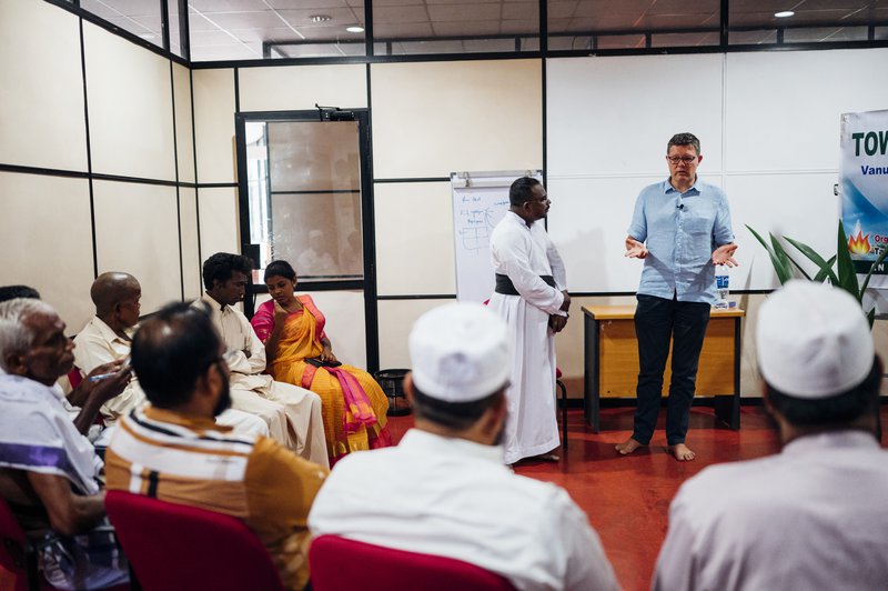 Peter Waddup speaks at an interfaith event in Sri Lanka in 2019.