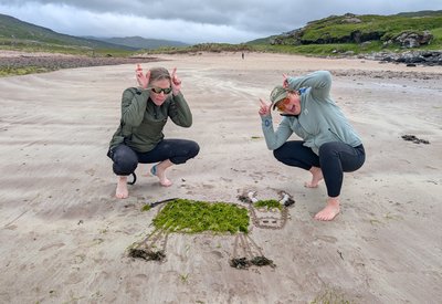 Sarah Jane Saunston and Freya Irvine create Highland Cow beach art on the Isle of Rùm.jpg