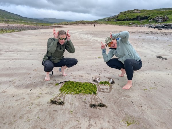 Sarah Jane Saunston and Freya Irvine create Highland Cow beach art on the Isle of Rùm.jpg