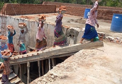 Women labourers working in 46 degree heat.